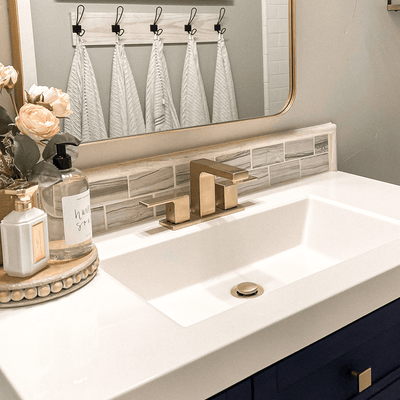 Capri 2 Handle 3 Hole Centerset Brass Bathroom Faucet with drain assembly in Champagne Gold finish Capri 2 Handle 3 Hole Centerset Brass Bathroom Faucet with drain assembly in Champagne Gold finish